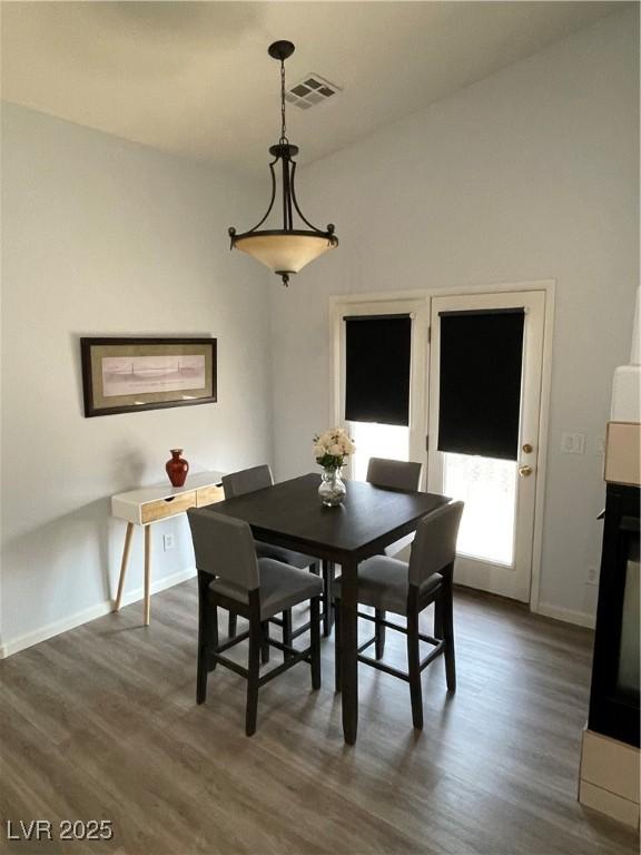 3521 Hazelnut Pine Pl Unit 1, North Las Vegas, NV 89084 - dining room featuring dark wood-type flooring and baseboards