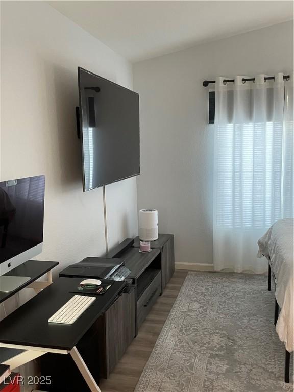 3521 Hazelnut Pine Pl Unit 1, North Las Vegas, NV 89084 - bedroom with light wood-type flooring and a desk