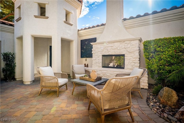 11830 Kingsbarns Ct, Las Vegas, NV 89141 - view of patio with an outdoor stone fireplace