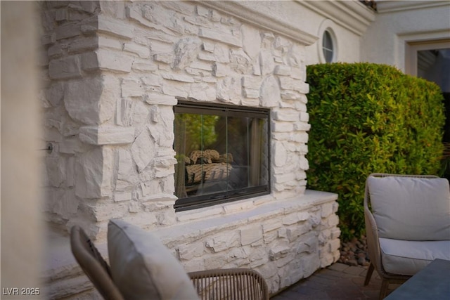 11830 Kingsbarns Ct, Las Vegas, NV 89141 - detailed view of a fireplace and stone siding