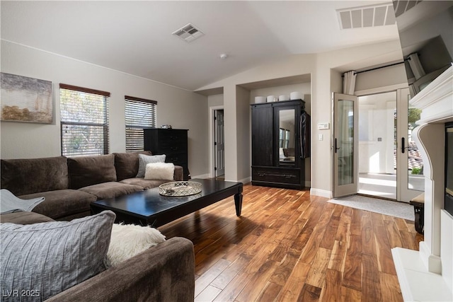 11830 Kingsbarns Ct, Las Vegas, NV 89141 - living room with vaulted ceiling and wood finished floors