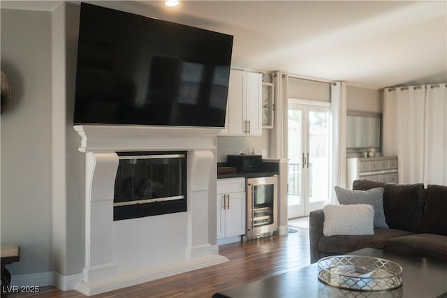 11830 Kingsbarns Ct, Las Vegas, NV 89141 - living area with wine cooler, dark wood finished floors, and bar area