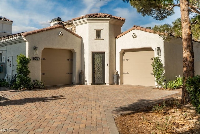 11830 Kingsbarns Ct, Las Vegas, NV 89141 - mediterranean / spanish home with a garage, stucco siding, and decorative driveway