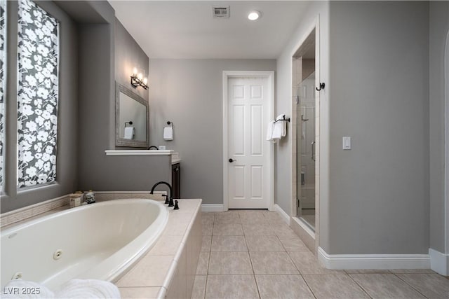 11830 Kingsbarns Ct, Las Vegas, NV 89141 - full bathroom featuring a whirlpool tub, a shower stall, and tile patterned flooring
