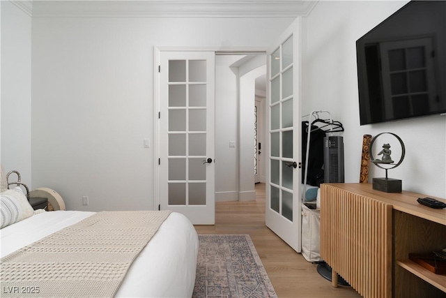 11830 Kingsbarns Ct, Las Vegas, NV 89141 - bedroom featuring french doors and light wood-type flooring