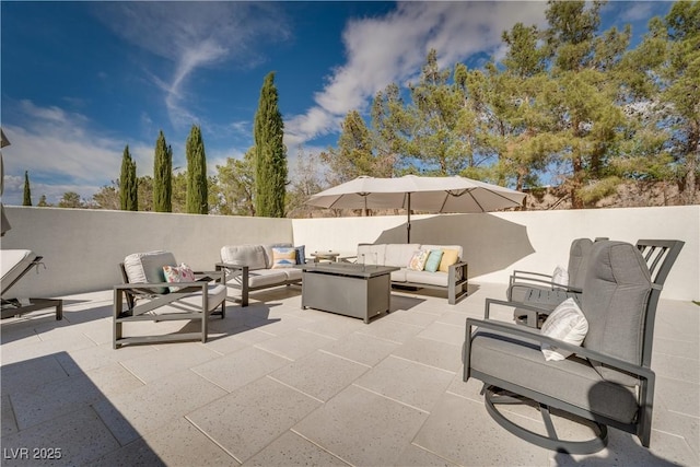 11830 Kingsbarns Ct, Las Vegas, NV 89141 - fenced backyard featuring an outdoor hangout area and a patio