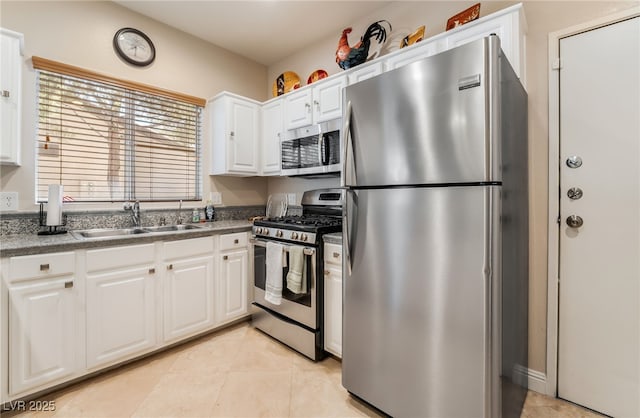 5250 S Rainbow Blvd Unit 1167, Las Vegas, NV 89118 - kitchen featuring appliances with stainless steel finishes, white cabinetry, and light tile patterned floors
