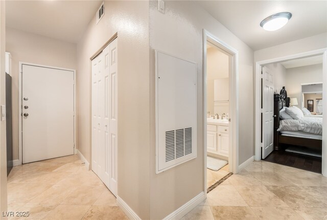 5250 S Rainbow Blvd Unit 1167, Las Vegas, NV 89118 - hall featuring a sink and light tile patterned floors