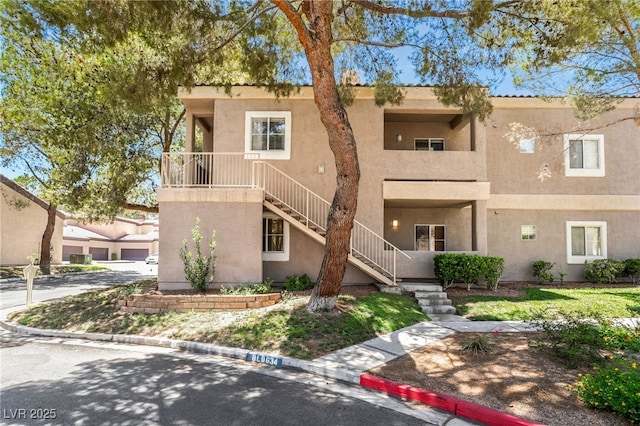 5250 S Rainbow Blvd Unit 1167, Las Vegas, NV 89118 - view of front of house featuring stairway and stucco siding