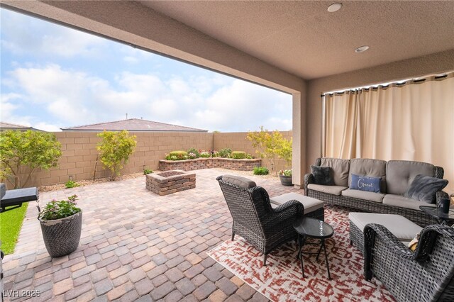 12478 Dolan Point St, Las Vegas, NV 89138 - fenced backyard with outdoor lounge area and a patio