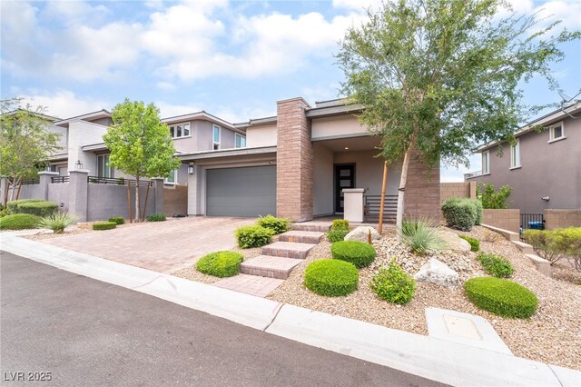 12478 Dolan Point St, Las Vegas, NV 89138 - view of front of home with stucco siding, decorative driveway, and a garage