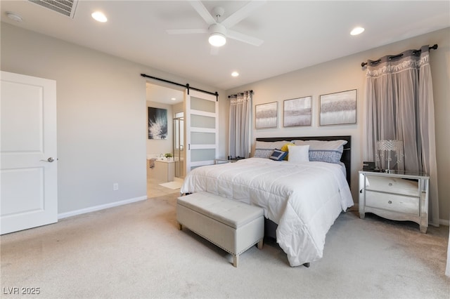 12478 Dolan Point St, Las Vegas, NV 89138 - bedroom with light colored carpet, a barn door, recessed lighting, ensuite bathroom, and a ceiling fan