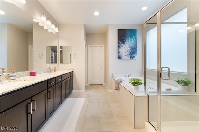 12478 Dolan Point St, Las Vegas, NV 89138 - full bathroom featuring double vanity, a garden tub, a shower stall, recessed lighting, and tile patterned floors