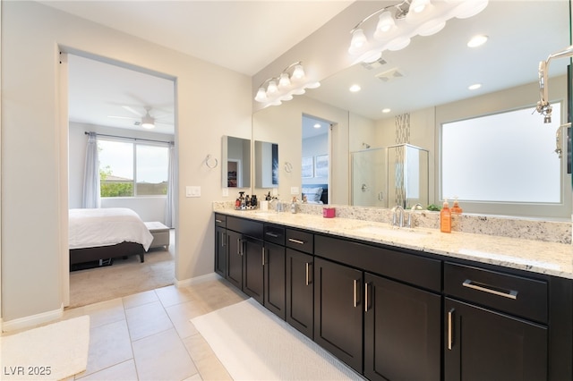 12478 Dolan Point St, Las Vegas, NV 89138 - bathroom featuring connected bathroom, double vanity, a shower stall, tile patterned floors, and a ceiling fan