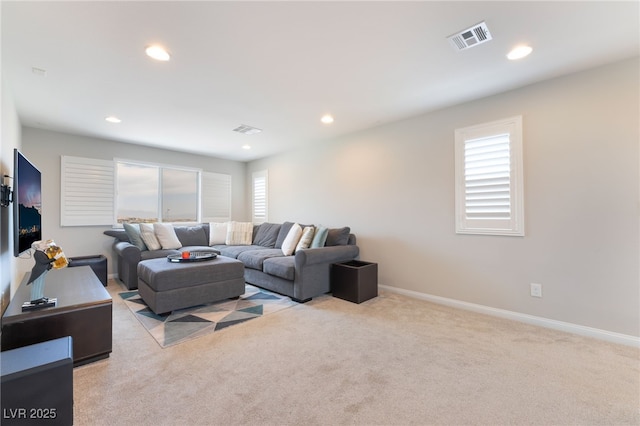 12478 Dolan Point St, Las Vegas, NV 89138 - living area with light carpet, recessed lighting, and plenty of natural light