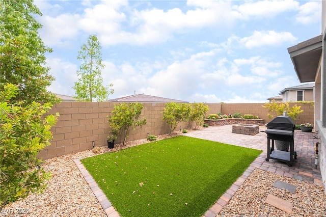 12478 Dolan Point St, Las Vegas, NV 89138 - fenced backyard with a patio area and an outdoor fire pit