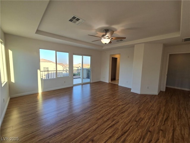 7428 Timber Run St, Las Vegas, NV 89149 - spare room with a tray ceiling, wood finished floors, and a ceiling fan