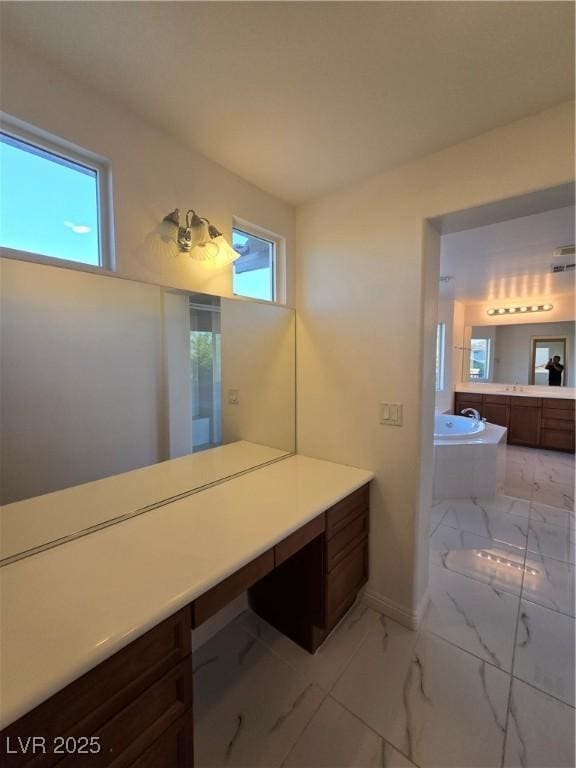 7428 Timber Run St, Las Vegas, NV 89149 - full bath featuring marble finish flooring, plenty of natural light, vanity, and a garden tub