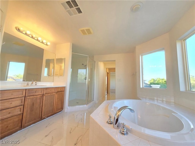 7428 Timber Run St, Las Vegas, NV 89149 - bathroom featuring vanity, a shower stall, a bath, and plenty of natural light