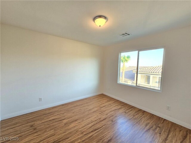 7428 Timber Run St, Las Vegas, NV 89149 - unfurnished room with wood finished floors and baseboards