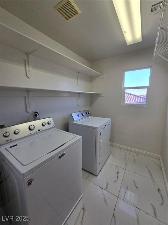7428 Timber Run St, Las Vegas, NV 89149 - laundry room featuring washer and clothes dryer and light marble finish floors