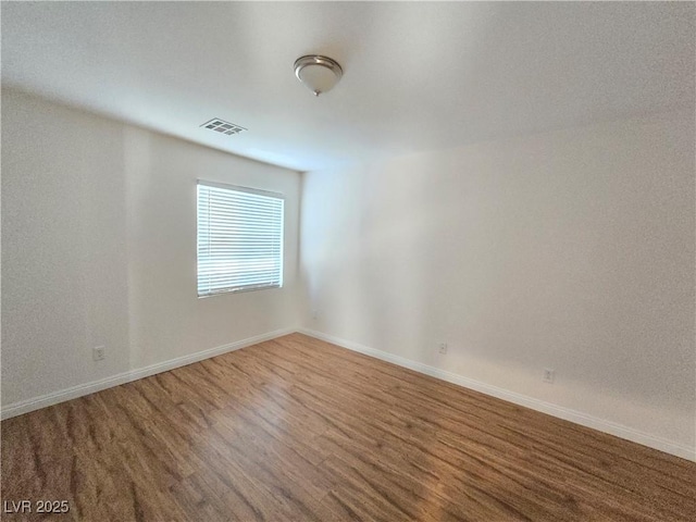7428 Timber Run St, Las Vegas, NV 89149 - spare room featuring wood finished floors and baseboards