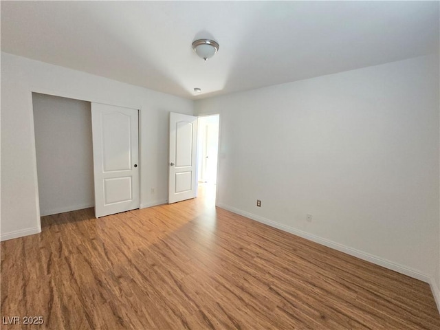 7428 Timber Run St, Las Vegas, NV 89149 - unfurnished bedroom featuring wood finished floors and a closet