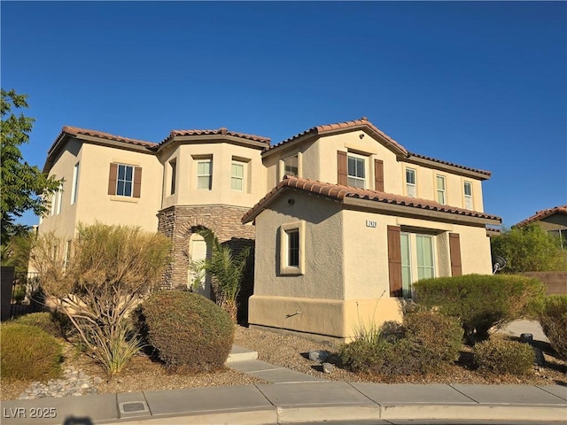7428 Timber Run St, Las Vegas, NV 89149 - mediterranean / spanish-style house featuring stucco siding, a tile roof, and stone siding