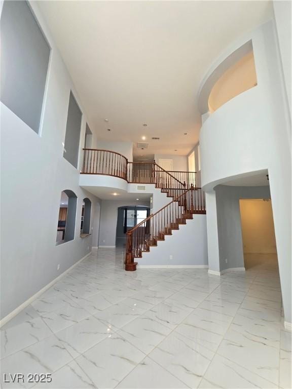 7428 Timber Run St, Las Vegas, NV 89149 - unfurnished living room featuring marble finish flooring, stairway, and recessed lighting