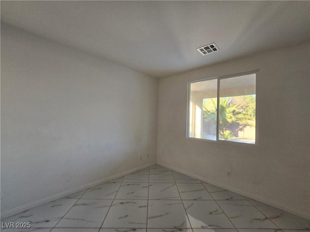 7428 Timber Run St, Las Vegas, NV 89149 - unfurnished room featuring light marble finish flooring and baseboards
