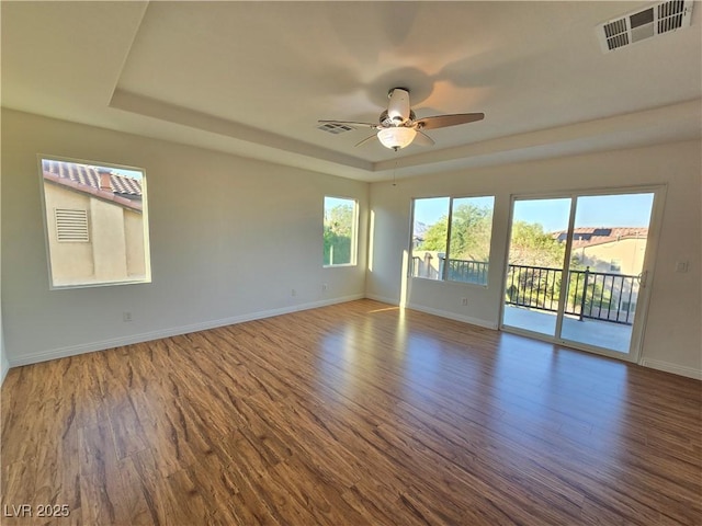7428 Timber Run St, Las Vegas, NV 89149 - unfurnished room featuring a tray ceiling, ceiling fan, and wood finished floors
