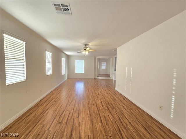 7428 Timber Run St, Las Vegas, NV 89149 - empty room with wood finished floors and a ceiling fan