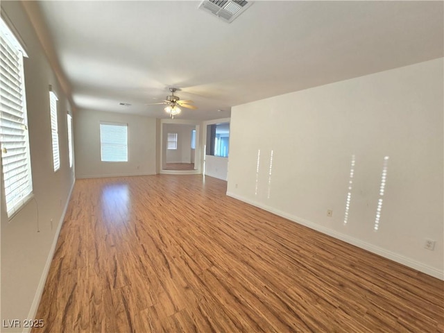 7428 Timber Run St, Las Vegas, NV 89149 - unfurnished living room with wood finished floors and ceiling fan