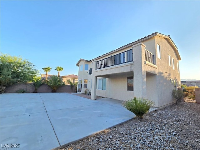 7428 Timber Run St, Las Vegas, NV 89149 - back of property with a balcony, stucco siding, a patio, and a fenced backyard