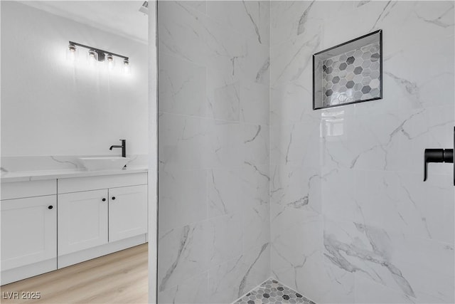 4186 Toronto Cir, Las Vegas, NV 89121 - full bathroom with vanity, a tile shower, and wood finished floors