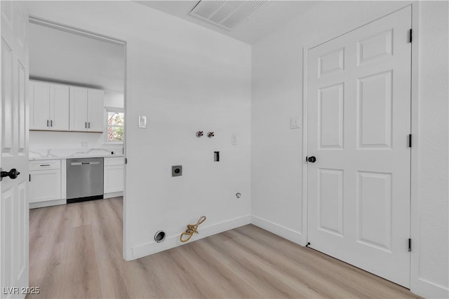 4186 Toronto Cir, Las Vegas, NV 89121 - washroom featuring gas dryer hookup, light wood finished floors, hookup for an electric dryer, and washer hookup