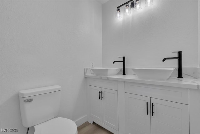 4186 Toronto Cir, Las Vegas, NV 89121 - bathroom featuring double vanity and wood finished floors