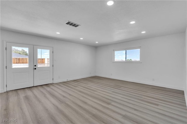 4186 Toronto Cir, Las Vegas, NV 89121 - spare room with french doors, light wood-style flooring, and recessed lighting