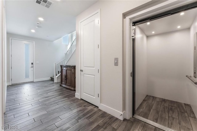 4122 Yucca Bloom St Unit 0, Las Vegas, NV 89135 - corridor featuring wood finished floors, stairway, elevator, and recessed lighting