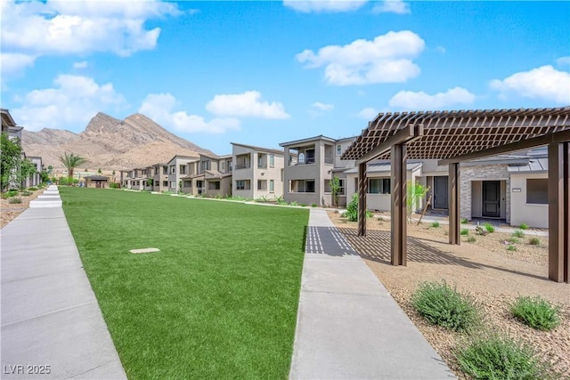 11418 Crimson Ledge Ave, Las Vegas, NV 89138 - surrounding community featuring a yard, a residential view, and a mountain view