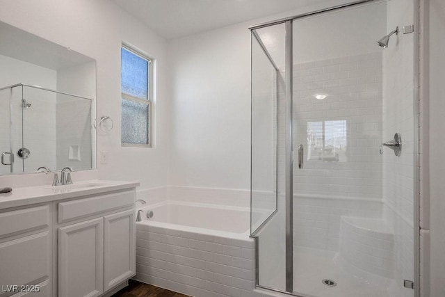 1110 Crystal Grotto Ave, North Las Vegas, NV 89081 - full bath featuring a shower stall, a garden tub, vanity, and wood finished floors