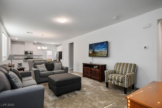 1110 Crystal Grotto Ave, North Las Vegas, NV 89081 - carpeted living area featuring a chandelier and baseboards
