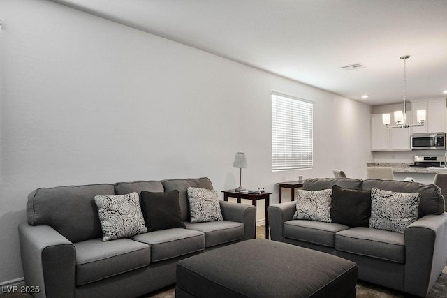 1110 Crystal Grotto Ave, North Las Vegas, NV 89081 - living room with a chandelier and recessed lighting