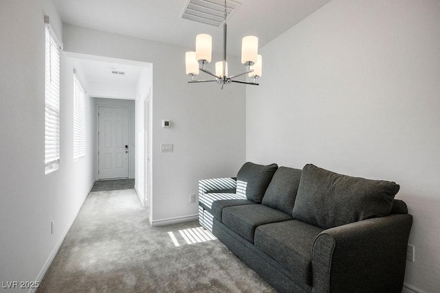 1110 Crystal Grotto Ave, North Las Vegas, NV 89081 - carpeted living room featuring a chandelier and baseboards