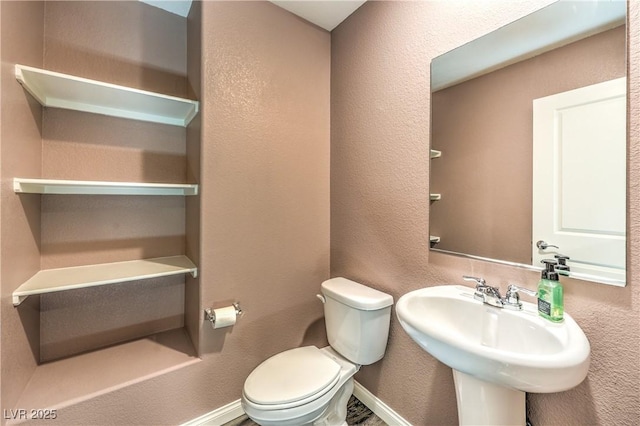 619 Harmony Rock Ave, North Las Vegas, NV 89081 - half bathroom with toilet and a textured wall