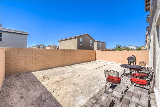 619 Harmony Rock Ave, North Las Vegas, NV 89081 - fenced backyard featuring a patio area