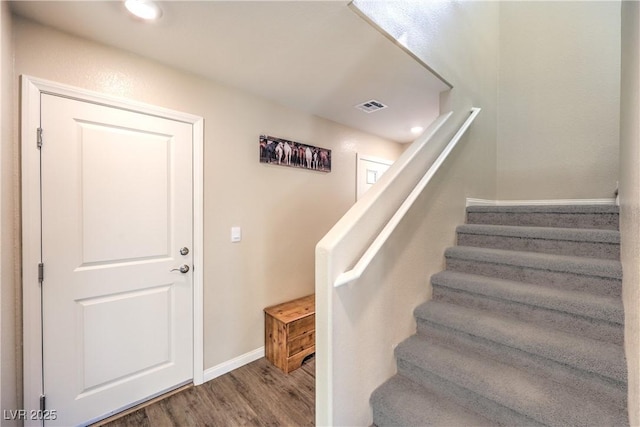 619 Harmony Rock Ave, North Las Vegas, NV 89081 - stairway featuring wood finished floors and baseboards