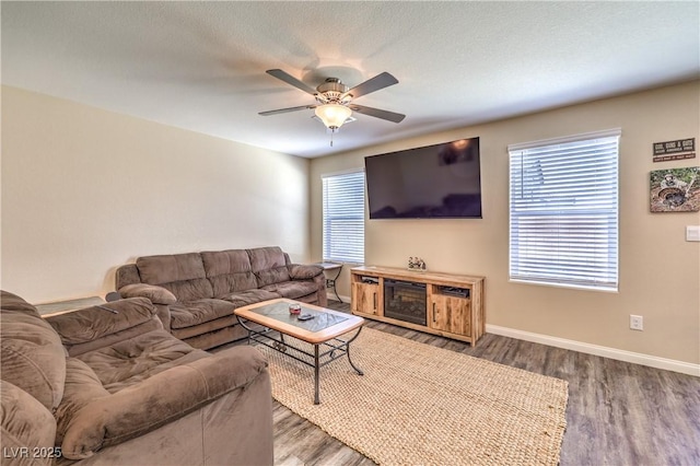 619 Harmony Rock Ave, North Las Vegas, NV 89081 - living area with wood finished floors, a ceiling fan, and healthy amount of natural light