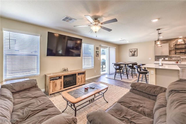 619 Harmony Rock Ave, North Las Vegas, NV 89081 - living room featuring light wood-type flooring, a ceiling fan, and recessed lighting