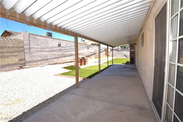 3323 Bancroft Cir, Las Vegas, NV 89121 - fenced backyard featuring a patio area